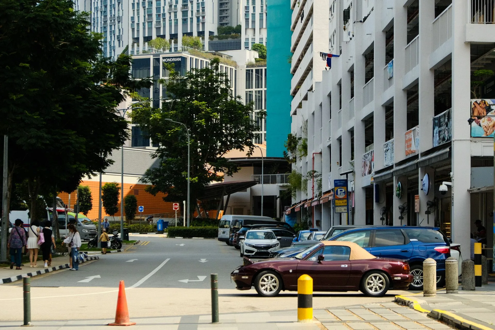 Slip road in Singapore with parked cars